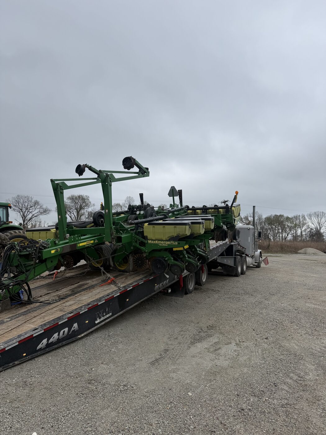 John Deere planter loaded on an AG Motion Landoll trailer