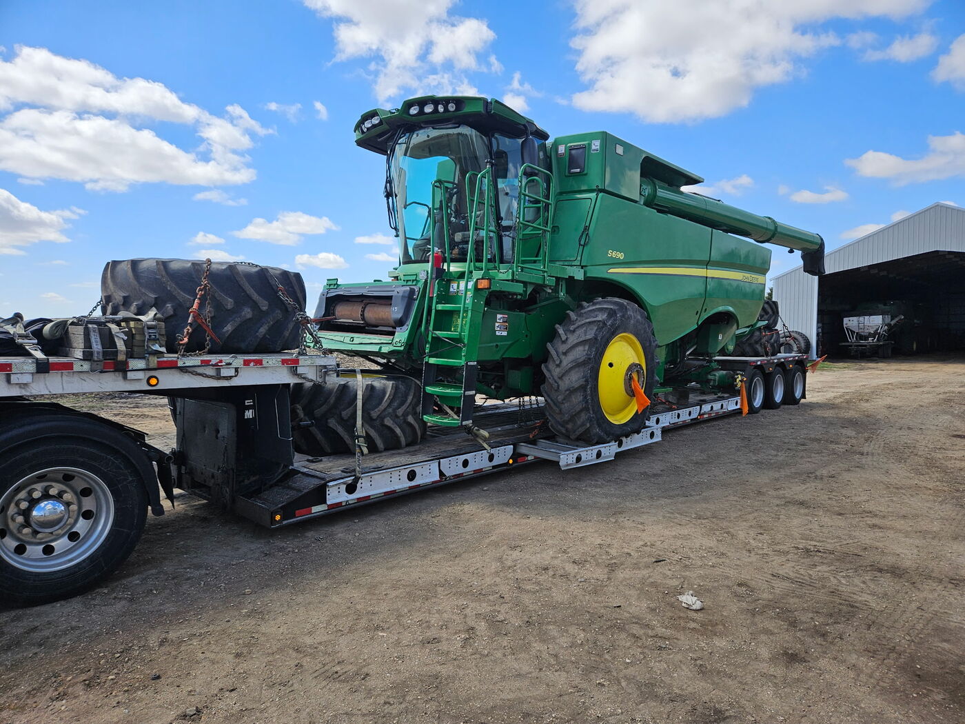 John Deere combine loaded for heavy-haul transport